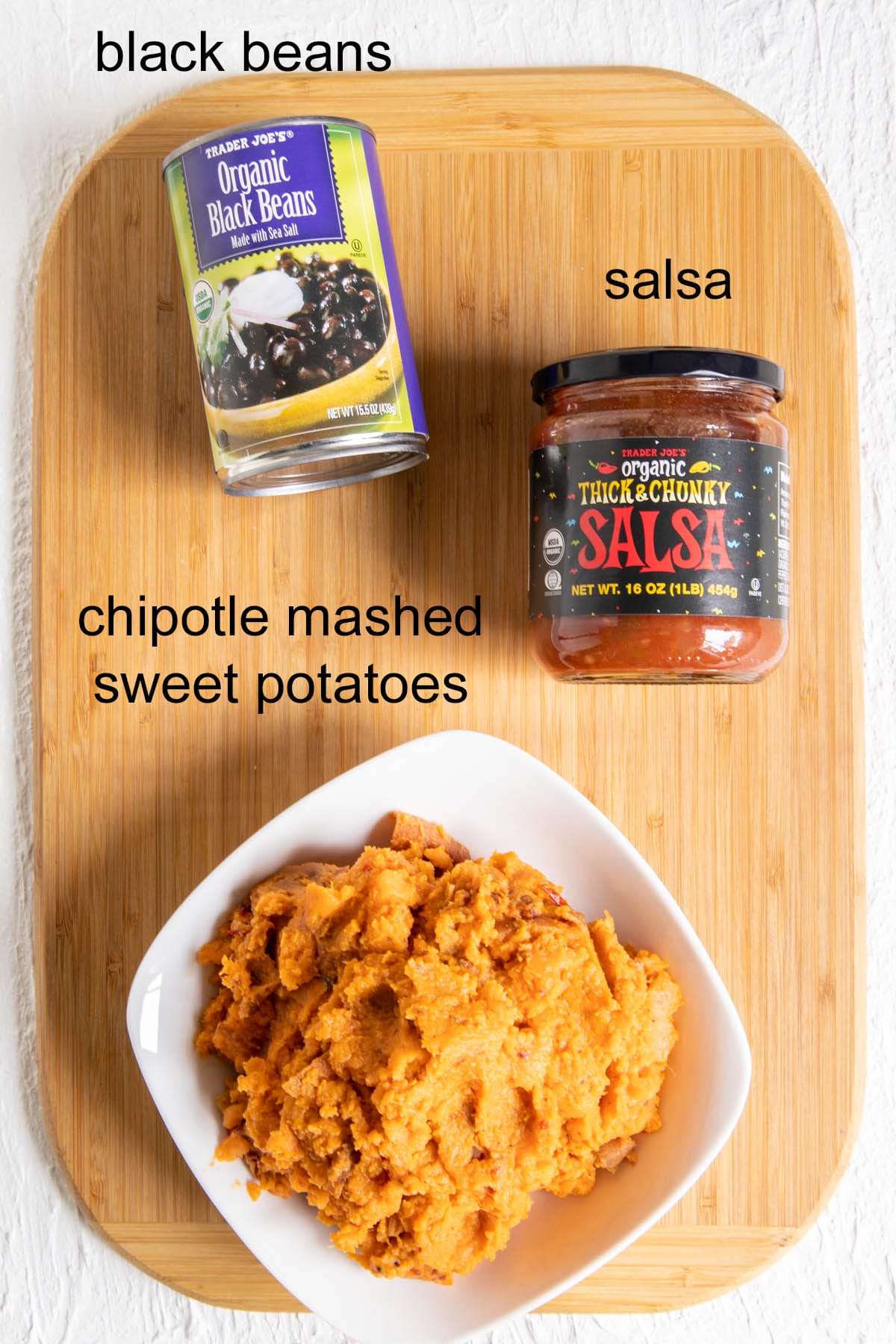 Ingredients on a cutting board with labels.