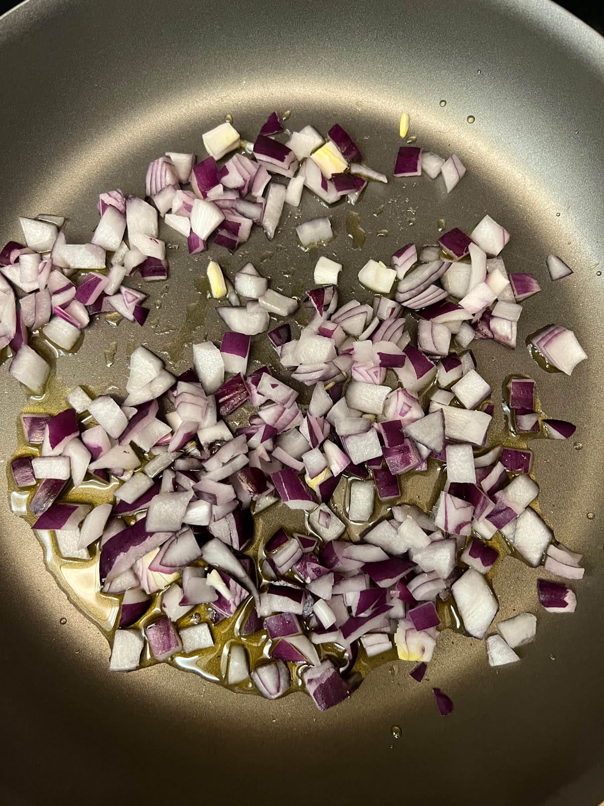 Chopped red onions in a pan.