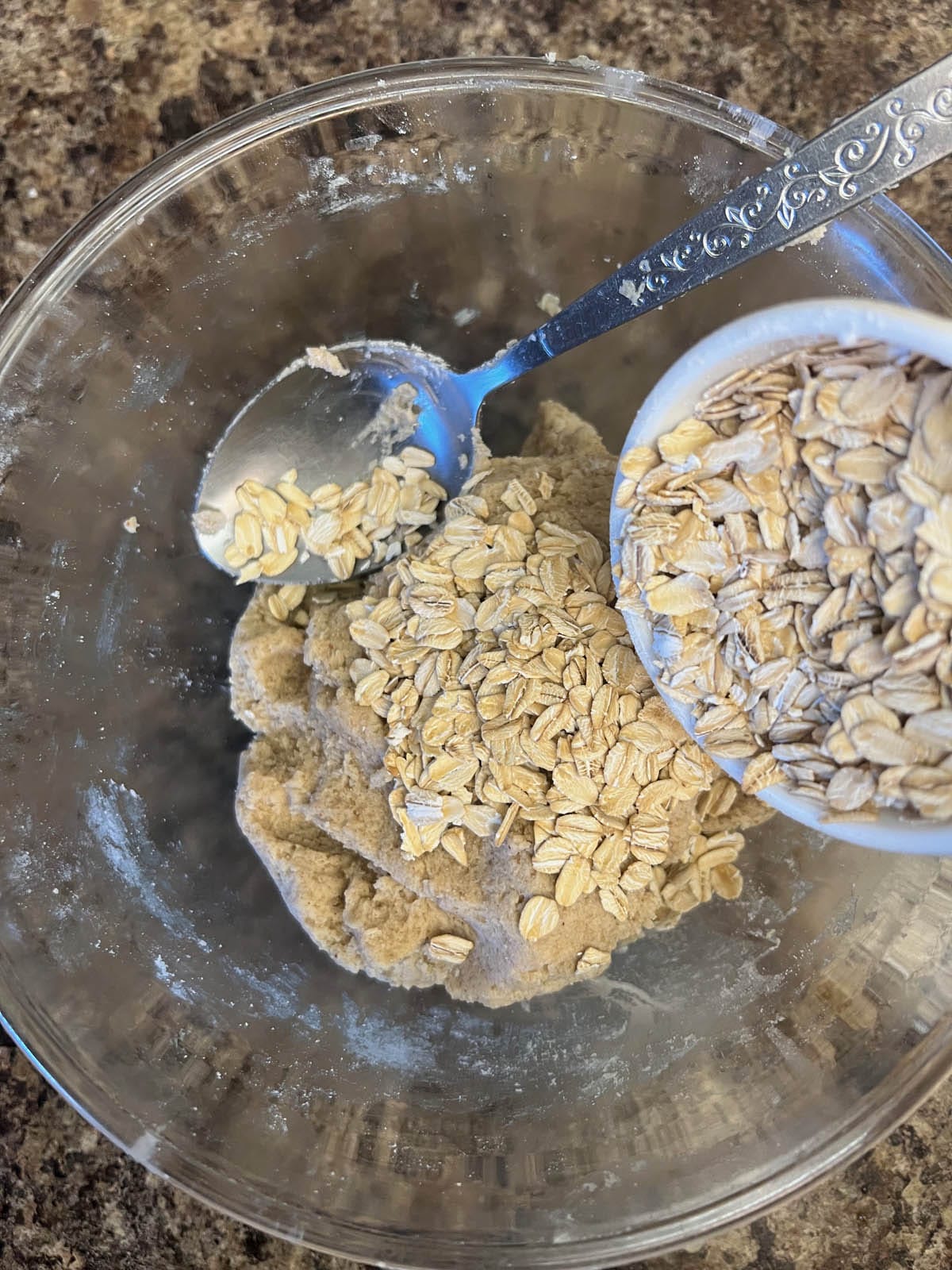 Rolled oats added to the bowl.