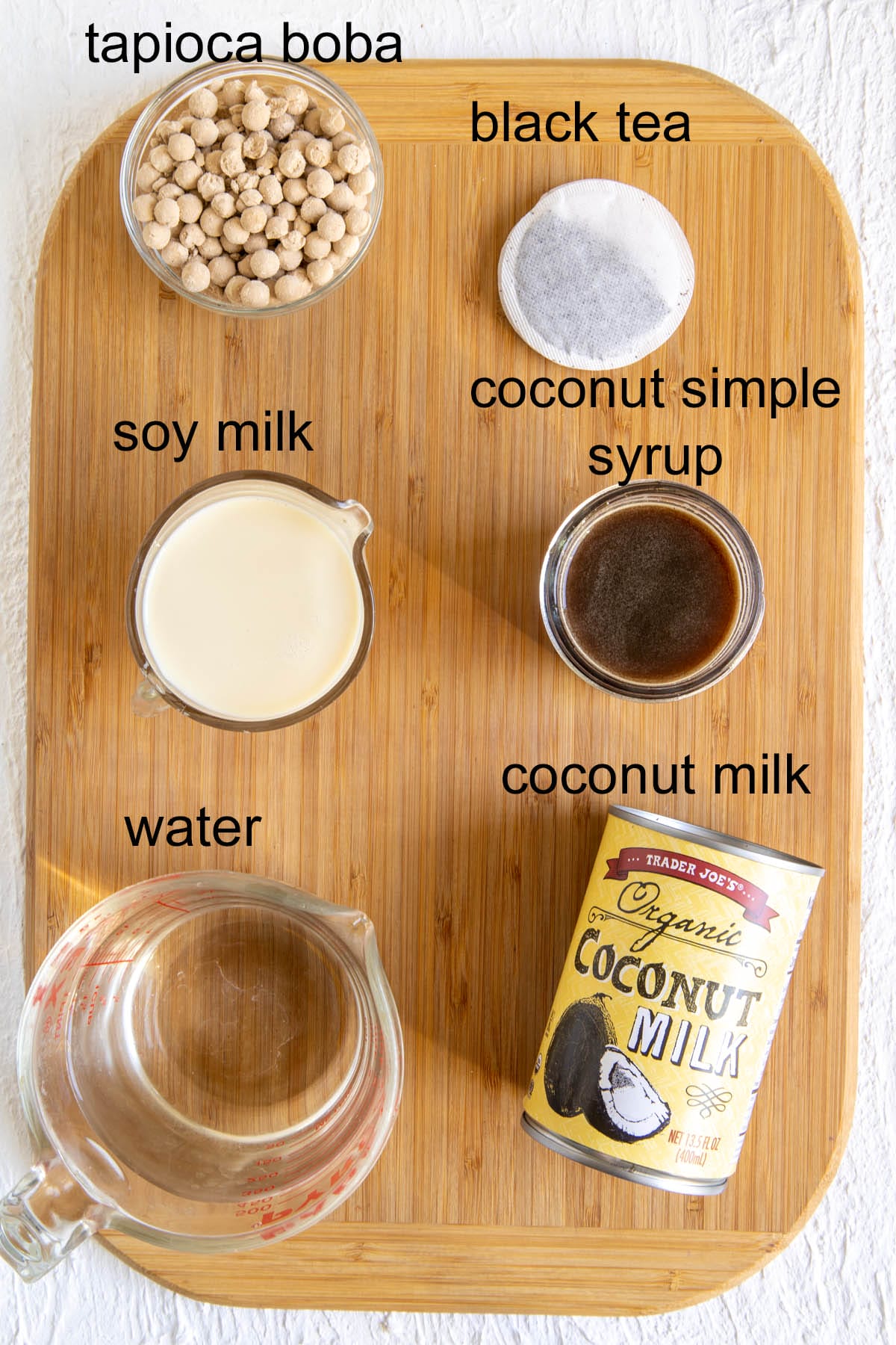 Coconut Boba Tea ingredients on a cutting board with labels.