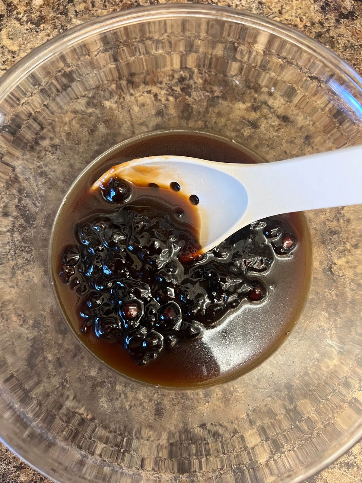 Boba and coconut simple syrup in a large mixing bowl.