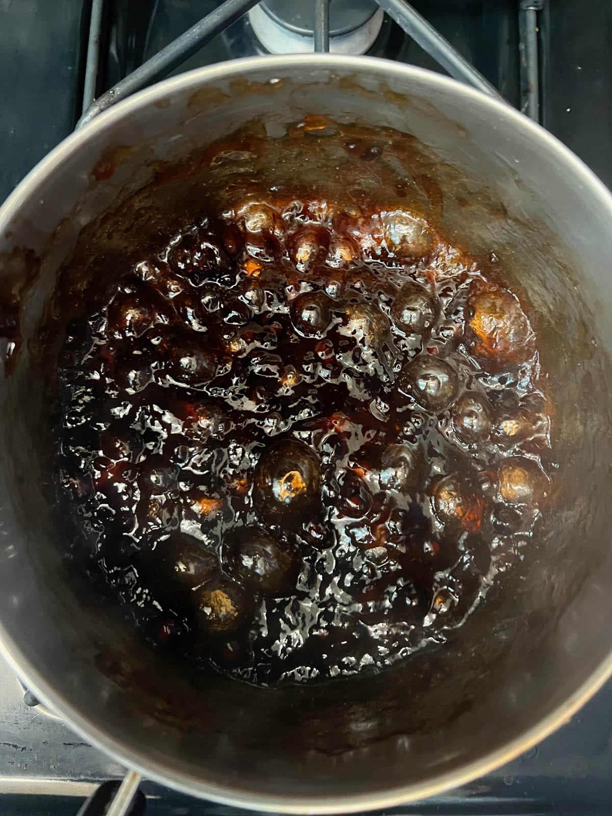Tapioca in boiling water in a saucepan.