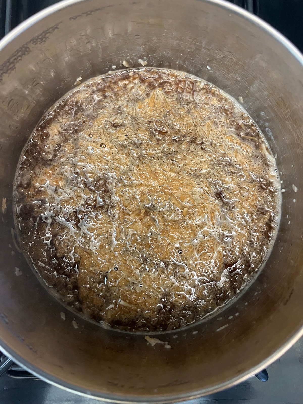 Cooked simple syrup in a saucepan.