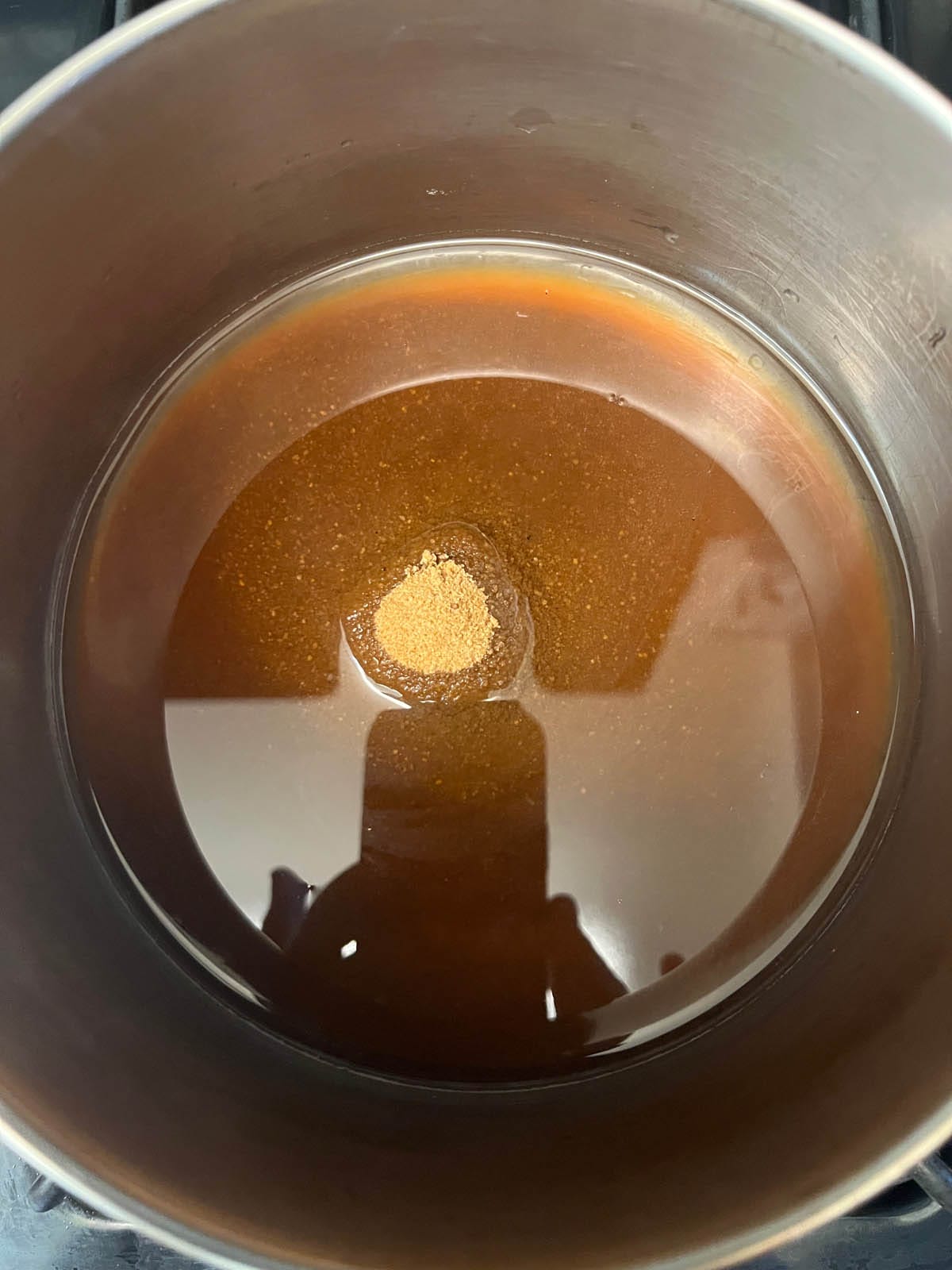 Water and coconut sugar in a saucepan.