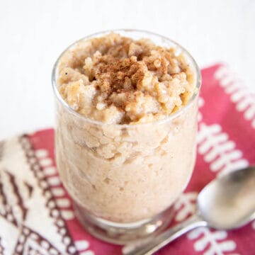 Vegan Rice Pudding in a jar with spoon.