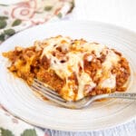 Vegan Slow Cooker Lasagna on a plate with fork.