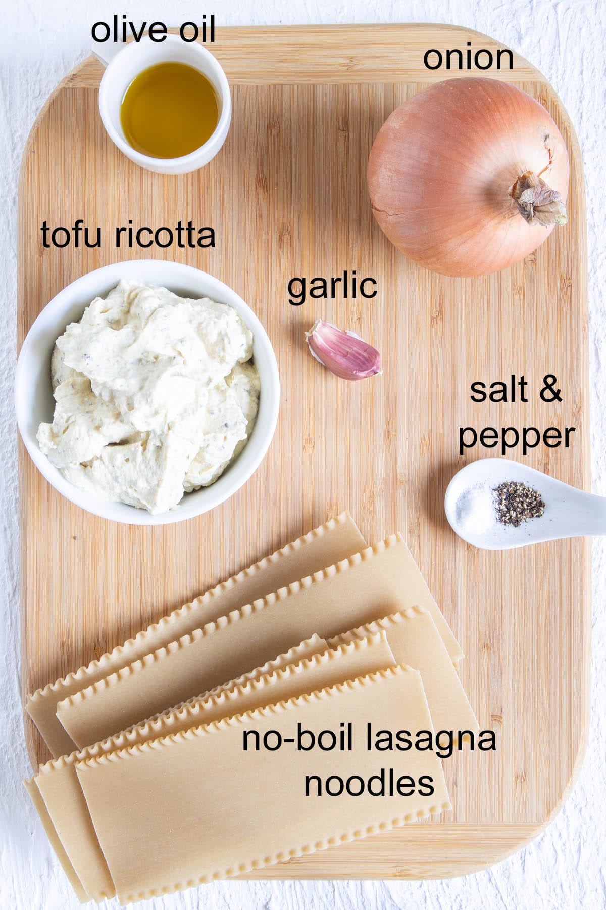 Ingredients on a cutting board with labels.