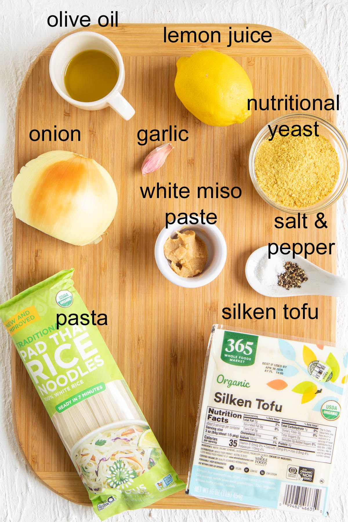 Ingredients on a cutting board with text.