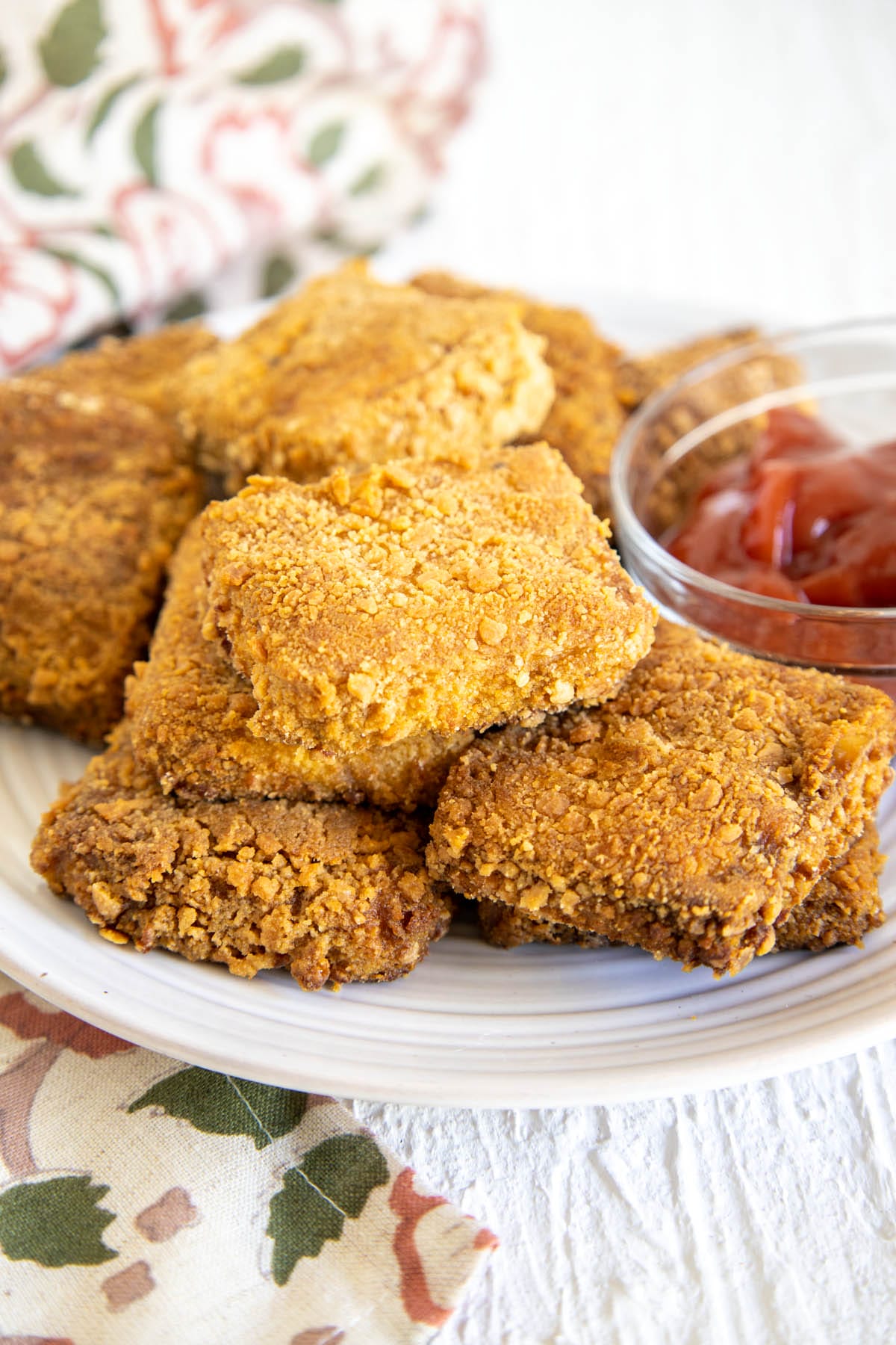 Panko Tofu on a plate with sauce.
