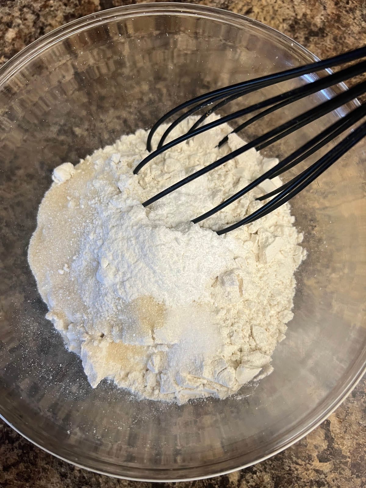 Dry ingredients in a mixing bowl with whisk.