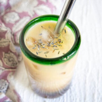 Lavender Bubble Tea in a glass with a straw.