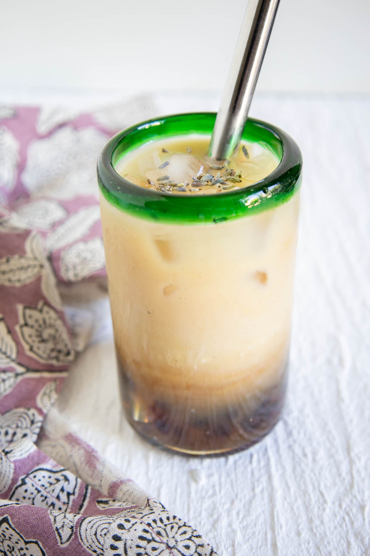 Lavender Bubble Tea in a glass with straw.