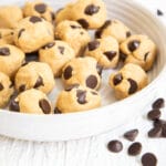 Cookie Dough Protein Bites with chocolate chips scattered about.